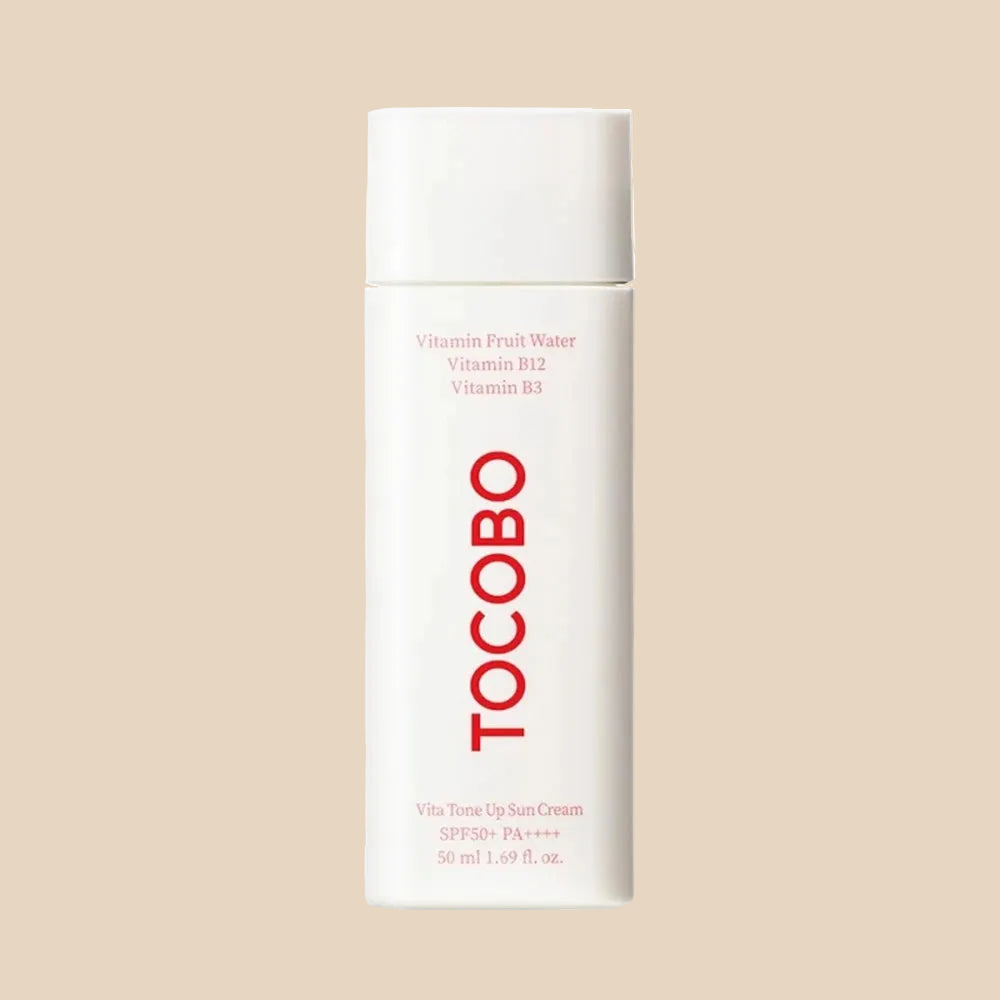 Tocobo skincare product with pink cream on a white background